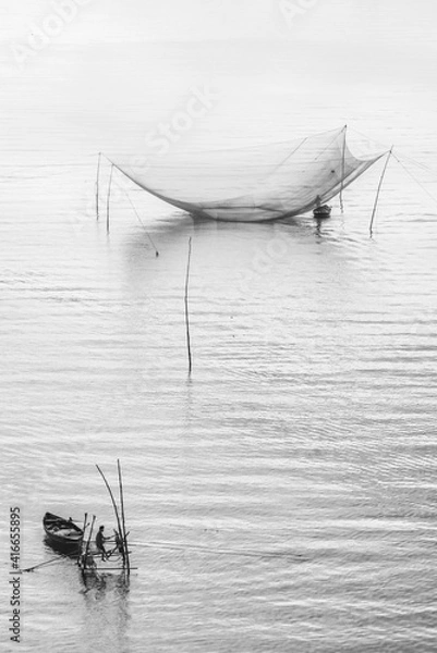 Fototapeta fishing net on river