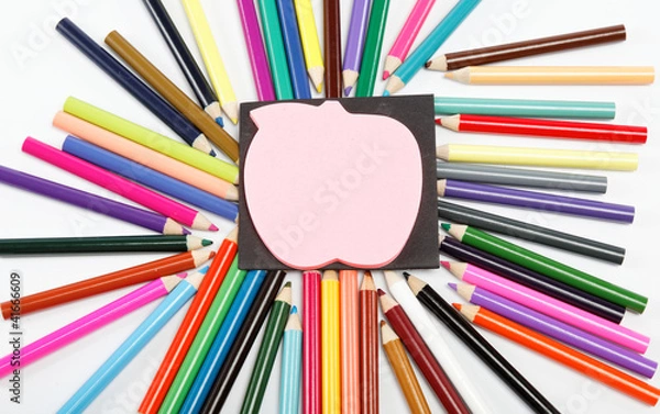 Fototapeta Notepad on a background of colored pencils.