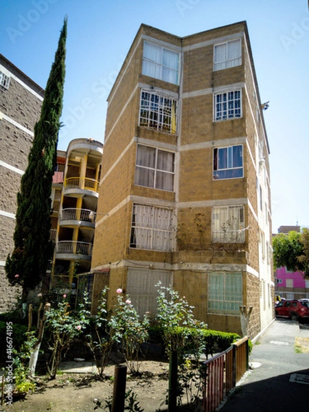 Obraz Building in a popular residential area, next to a small park