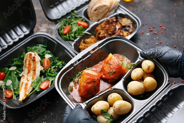 Obraz Takeaway food in a box. Ready prepared meal in a box. Tasty catering delivered to the office.