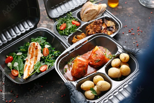 Obraz Takeaway food in a box. Ready prepared meal in a box. Tasty catering delivered to the office.