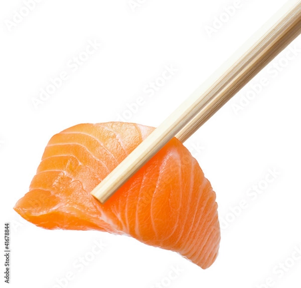 Fototapeta Chopsticks with sliced raw salmon