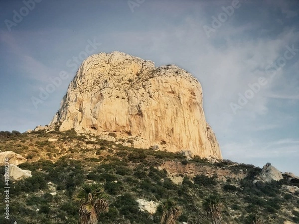 Fototapeta Peñon de Calpe viewed from below against the sky