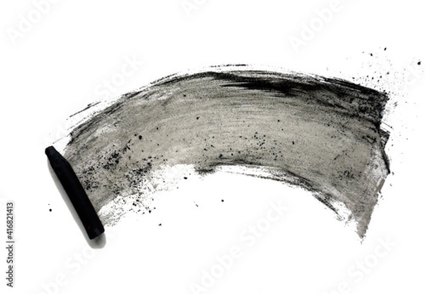 Fototapeta Black compressed charcoal sticks for drawing. Abstract black shapeless spot and charcoal sticks on a white background. Texture with chaotic smudges.