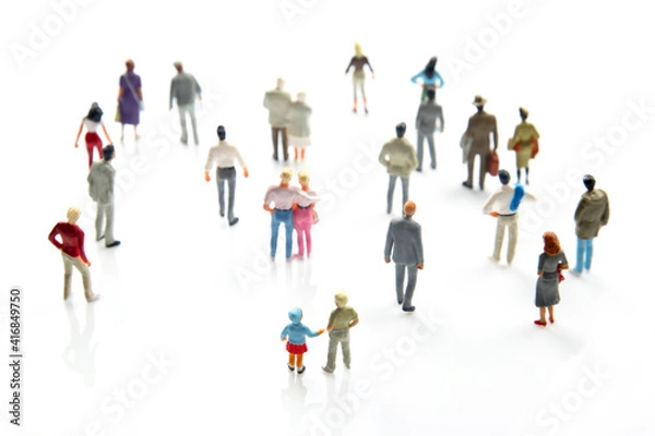 Fototapeta miniature people. different people stand on a white background. communication of society of different generations