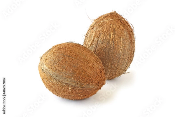Fototapeta Two coconuts isolated on white
