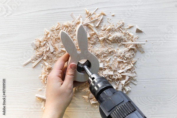 Fototapeta do it yourself: easter bunny - wooden egg stand. Step 5: hands drill with a large round drill bit to make a hole for the Easter egg