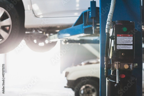 Obraz Mechanic repairing a car