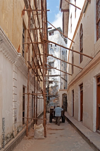 Obraz worker on the street in the old town