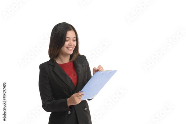 Obraz Asian business woman is holding a tablet and the other hand holding a pen and expressing joy. On white Background.