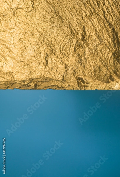 Fototapeta Gold texture. Rough structure mineral. Rock texture. Gold Ore. Gold rocks. Stone blue background.