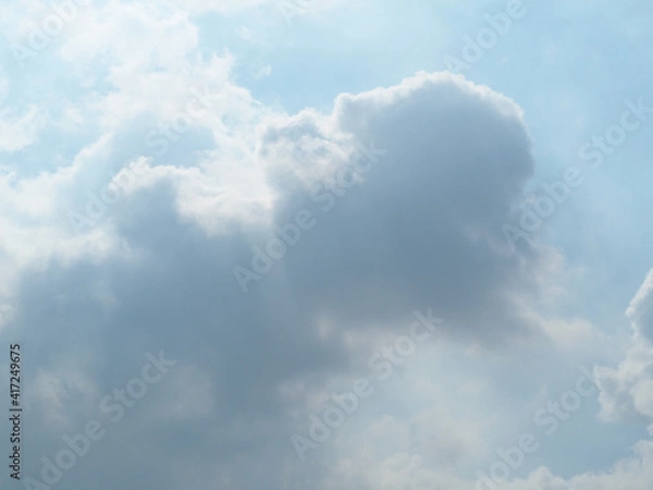 Obraz Clouds in the sky and white light shines down.