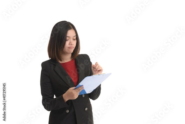 Obraz Asian business woman is holding a tablet and the other hand holding a pen. On white Background.