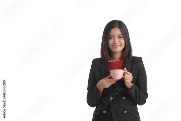 Obraz Asian business woman is holding a cup of coffee and expressing joy. On white Background.