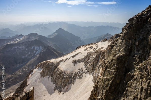 Obraz Impressive image of a mountain range from the top of a mountain with snow and steep walls