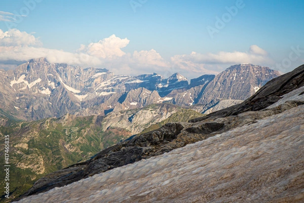 Obraz Panoramic view of snow-capped mountains from a glacier in summertime