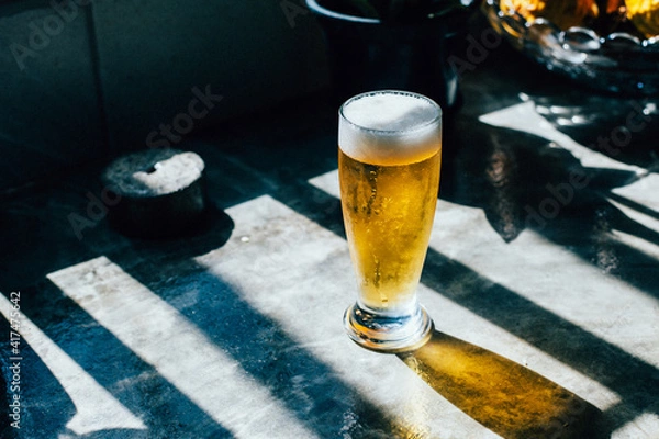 Obraz Glass of beer on a concrete counter