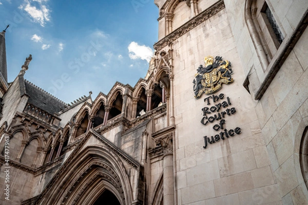 Fototapeta Law and order, judicial branch of government and Victorian architecture concept with arched doorway leading to the Great Hall of the Royal Courts Justice