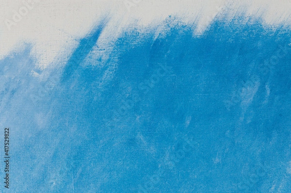 Fototapeta creative background, a spot of heavenly colored primer rubbed on the surface of a linen canvas, temporary object, close, toning