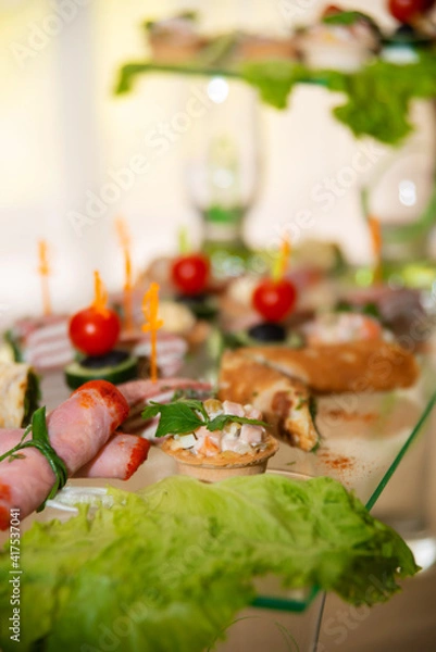 Obraz Empty glasses set, Elegant table setting for a festive dinner in the restaurant. Snacks on the buffet table