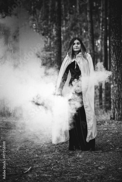 Fototapeta Witch at wood, fog around, magic concept, illustration for rituals and mystical scene