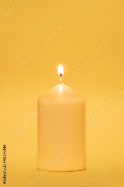 Fototapeta Coloured candle against the same coloured background