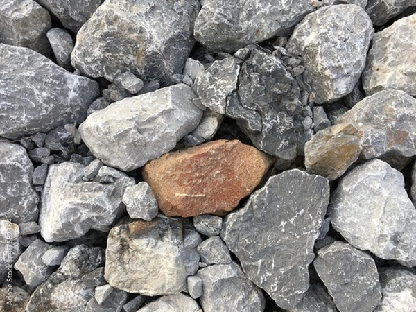 Fototapeta The background image of gray rocks is random stacked beautifully.