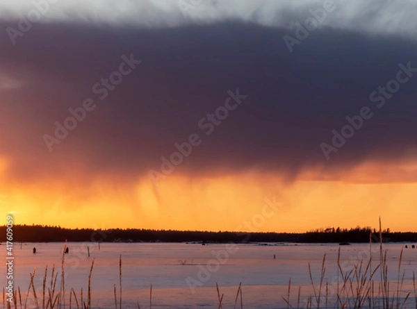 Fototapeta cloud color above and below during sunset with sea ice