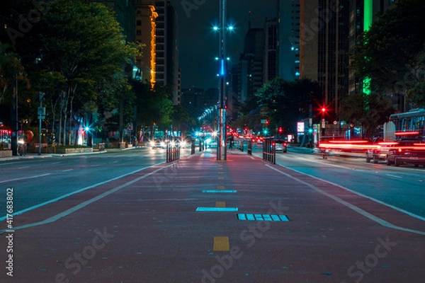 Fototapeta Sao Paulo, Brazil - February 6, 2021 -Movement of car lights at night on Avenida Paulista.