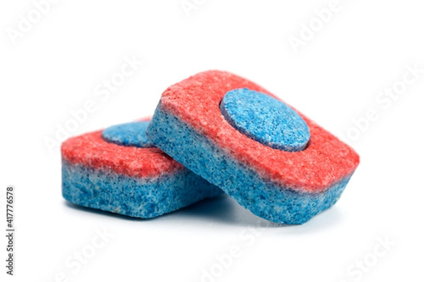 Obraz two dishwasher tablets close up on a white isolated background