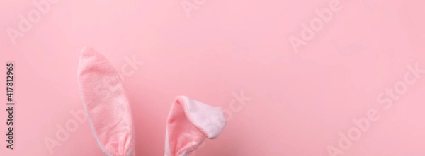 Fototapeta pink rabbit ears over pink background, minimal easter background, panoramic mock-up