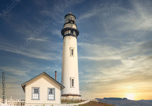 Fototapeta Pigeon Point lighthouse against the backdrop of a beautiful sky and ocean with waves, a great landscape of the Pacific coast in California