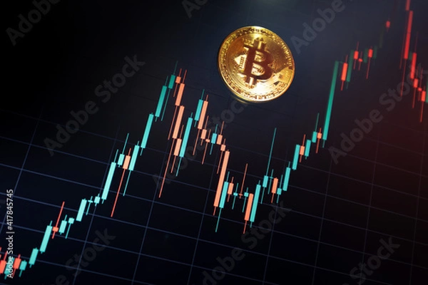 Fototapeta Bitcoin cryptocurrency coin on the background of the exchange chart