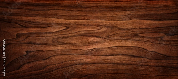 Fototapeta Walnut tree texture close up. Wide walnut wood texture background. Walnut veneer is used in luxury finishes.