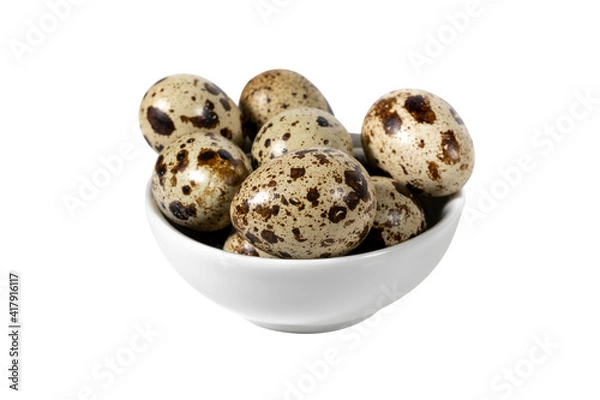 Obraz Boiled spotted quail eggs in a white ceramic  bowl , isolated on white background.  Healthy Food Products Concept