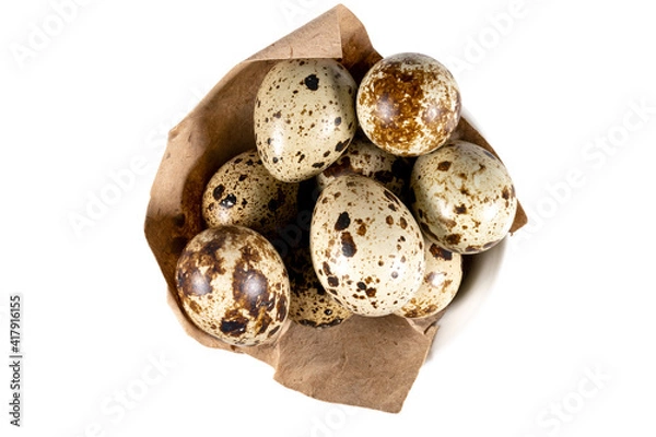 Obraz Boiled spotted quail eggs in a white ceramic  bowl , isolated on white background.  Healthy Food Products Concept