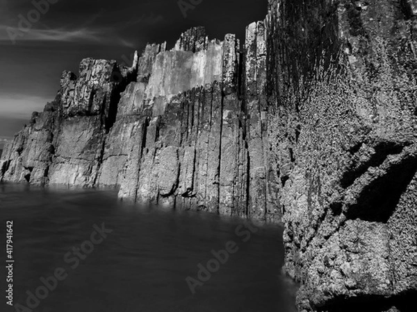 Fototapeta Rocks with straight edges on a beach