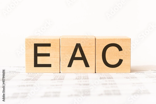 Fototapeta Word eac. Wooden small cubes with letters isolated on white background with copy space available.Business Concept image.