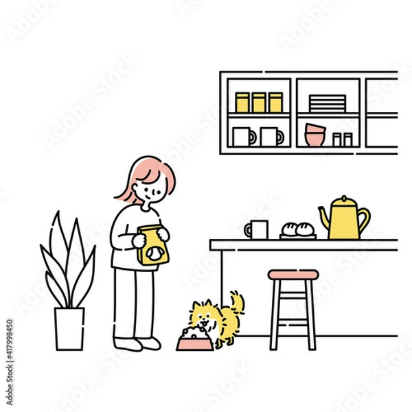 Obraz キッチンで犬にごはんをあげる女性