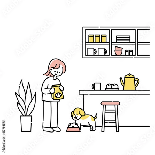 Obraz キッチンで犬にごはんをあげる女性