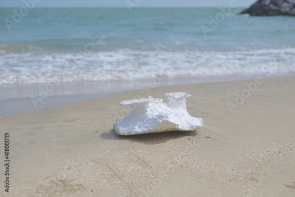 Fototapeta Styrofoam debris or garbage on the sand beach, marine debris pollution