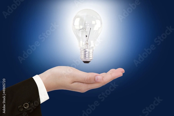 Obraz women hand with Light bulb