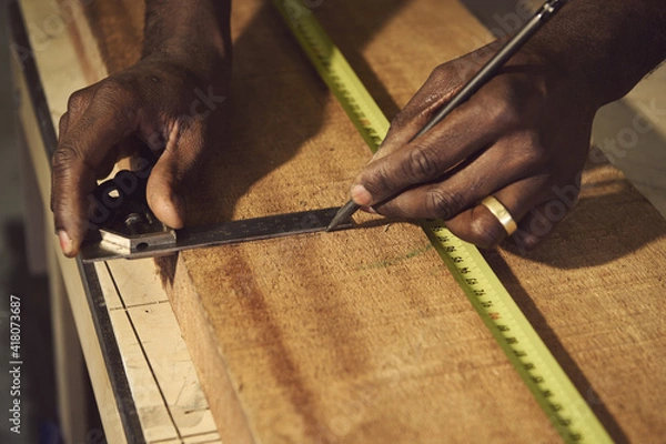 Obraz carpenter measuring wood