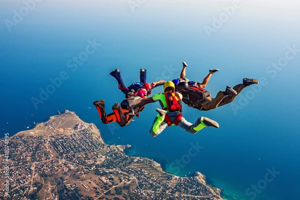 Obraz Skydiving group over the sea