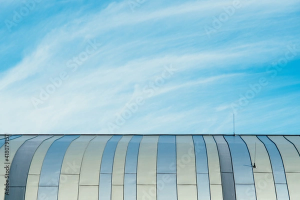 Obraz modern glass roof in front of cloudy blue sky