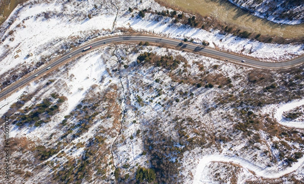 Fototapeta Aerial view on mountain road from drone in