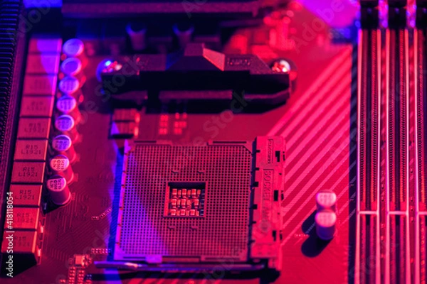 Obraz Blurred background. Socket am4. Close up of the AM4 socket for the motherboard with neon blue and red lights. Technological background