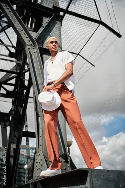 Obraz man standing on a crane