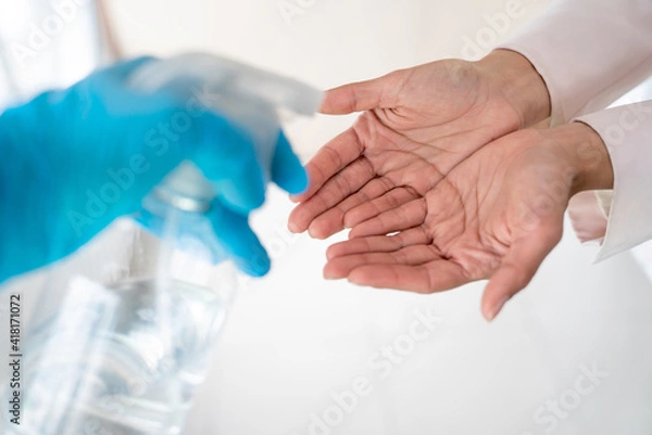 Obraz Hand disinfection with hand sanitizer .