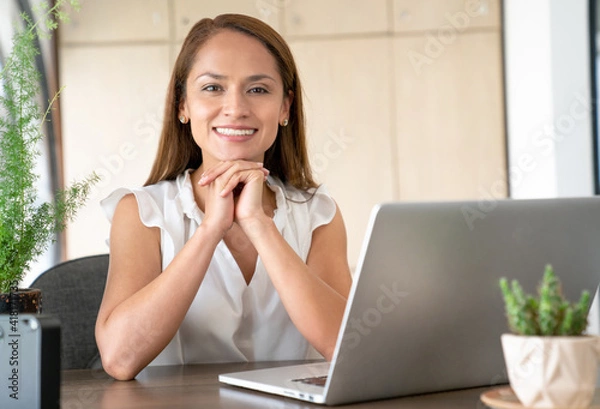 Obraz Woman in the office happy smiling at the camera.